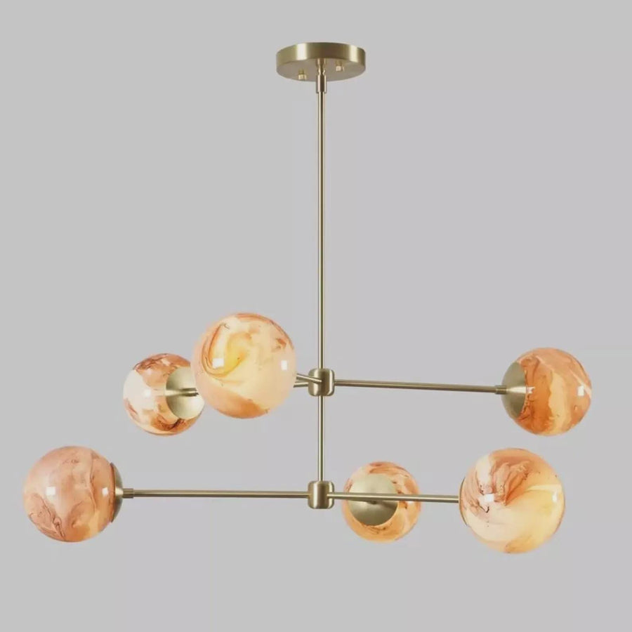Handmade brass ceiling light with six marble glass globes, designed for living rooms and dining spaces with warm ambient illumination.