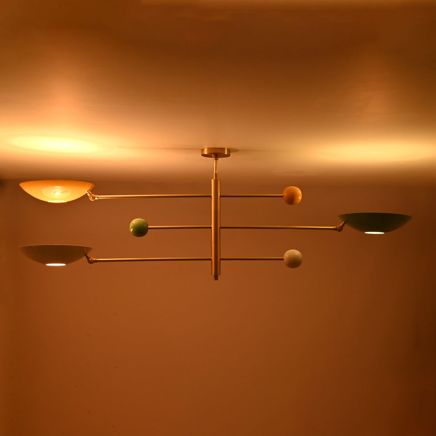 Modern brass flush mount ceiling light with multicolor bowl shades arranged in balanced geometric symmetry