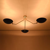 Modern brass flush mount ceiling light providing soft indirect illumination with blue bowl shades