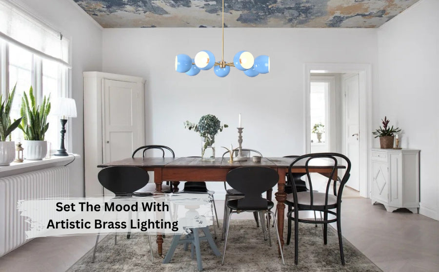 Modern brass chandelier with six blue globe shades – front view against white background.