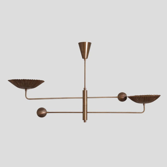Modern brass chandelier featuring fluted bowl shades on a balanced frame, elegant handmade ceiling lighting design.