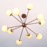Handcrafted modern brass chandelier with opal glass globes and radiating arms providing warm ambient lighting.