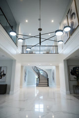 Modern brass LED pendant light with natural black brass finish, round ceiling canopy, and sleek architectural design