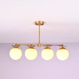 Modern linear brass chandelier with four opal glass globes, designed for dining rooms and contemporary interiors.
