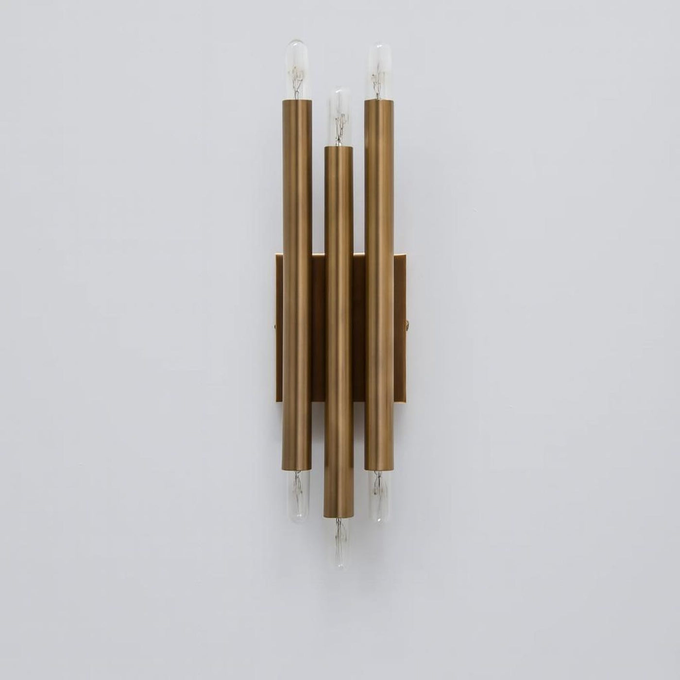 Handcrafted modern brass vertical wall lamp with six exposed E26 bulbs and symmetrical tube design