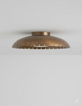 Modern brushed brass flush mount ceiling light with bowl-shaped shade and clean low-profile silhouette