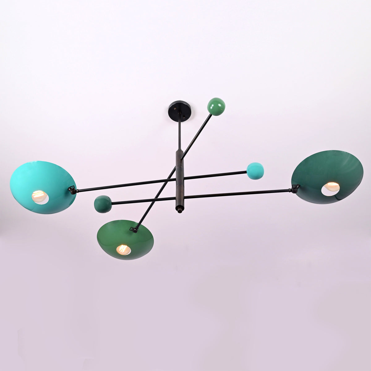 Top angled view of modern Sputnik chandelier with green and teal disc shades