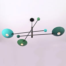 Top angled view of modern Sputnik chandelier with green and teal disc shades