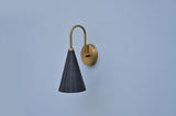 Modern cone-shaped wall lamp in solid brass and black finish, artisan lighting design by Brass Leaf Studio