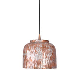 Modern copper pendant light styled above a dining area with cozy warm light and refined interior décor