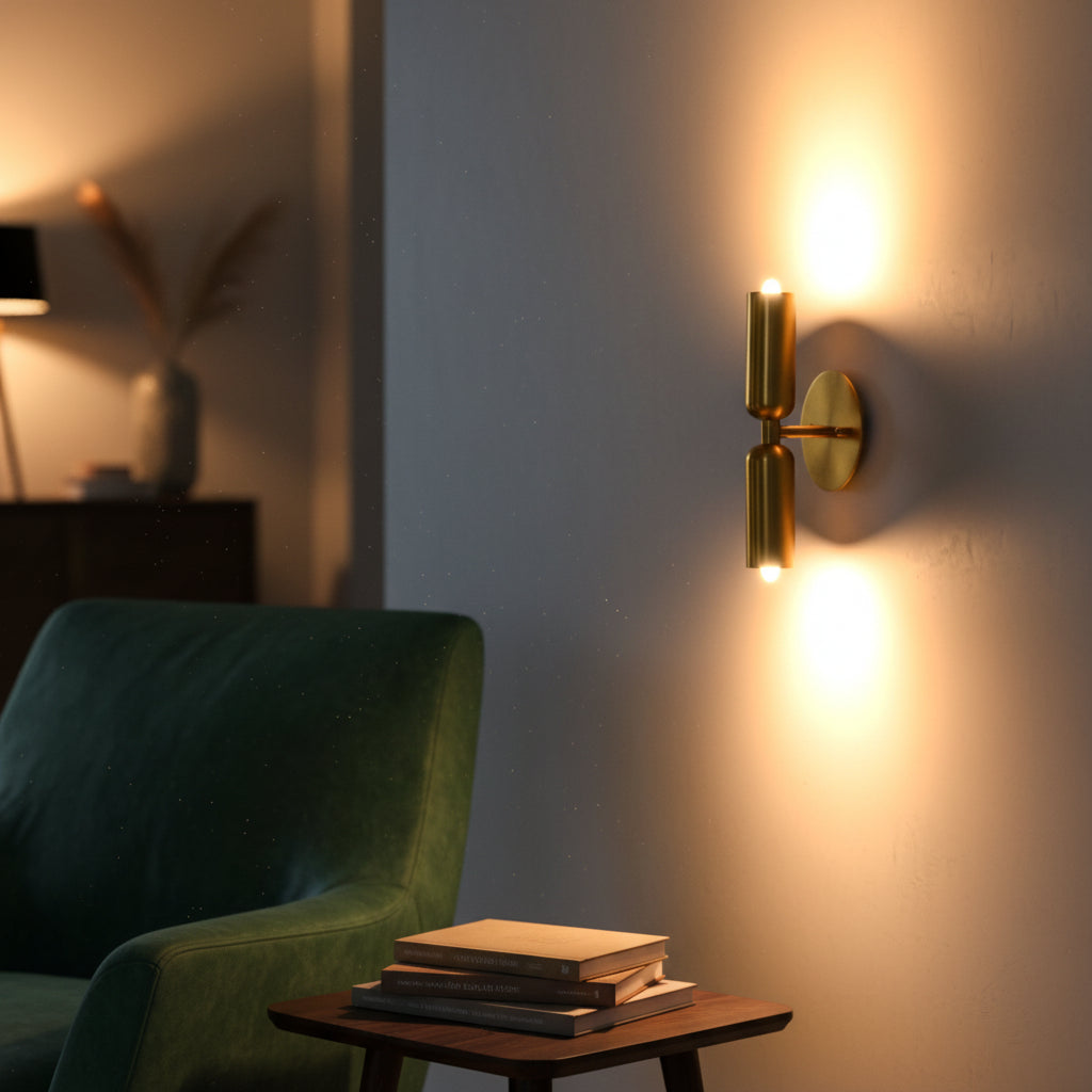 Modern cylindrical brass wall fixture with two light design, brass patina finish, and warm architectural wall lighting
