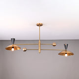 Front view of handcrafted 4-light Diabolo brass chandelier with brushed brass shades and contrasting black cone sockets.