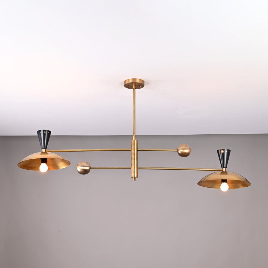 Front view of handcrafted 4-light Diabolo brass chandelier with brushed brass shades and contrasting black cone sockets.