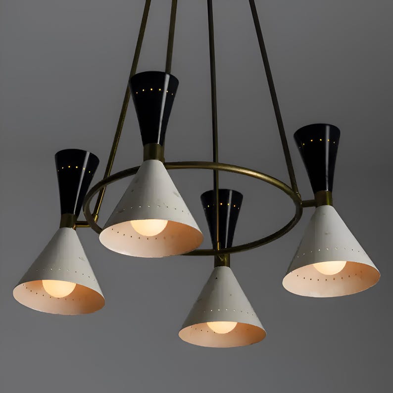 Diabolo style brass chandelier with cone-shaped shades and minimalist circular frame creating warm ambient lighting