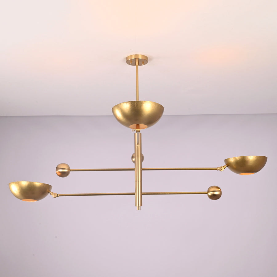 Front view of modern disc style 3 light brass chandelier with bowl shades by Brass Leaf Studio