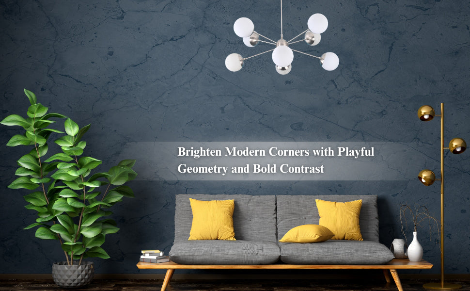 Modern geometric brass chandelier with white globes hanging in a stylish living room with blue accent wall and yellow cushions.