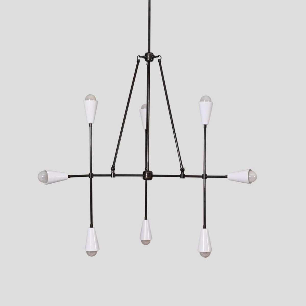 Industrial modern chandelier in black brass with eight white cone lamp shades, handcrafted ceiling light fixture.