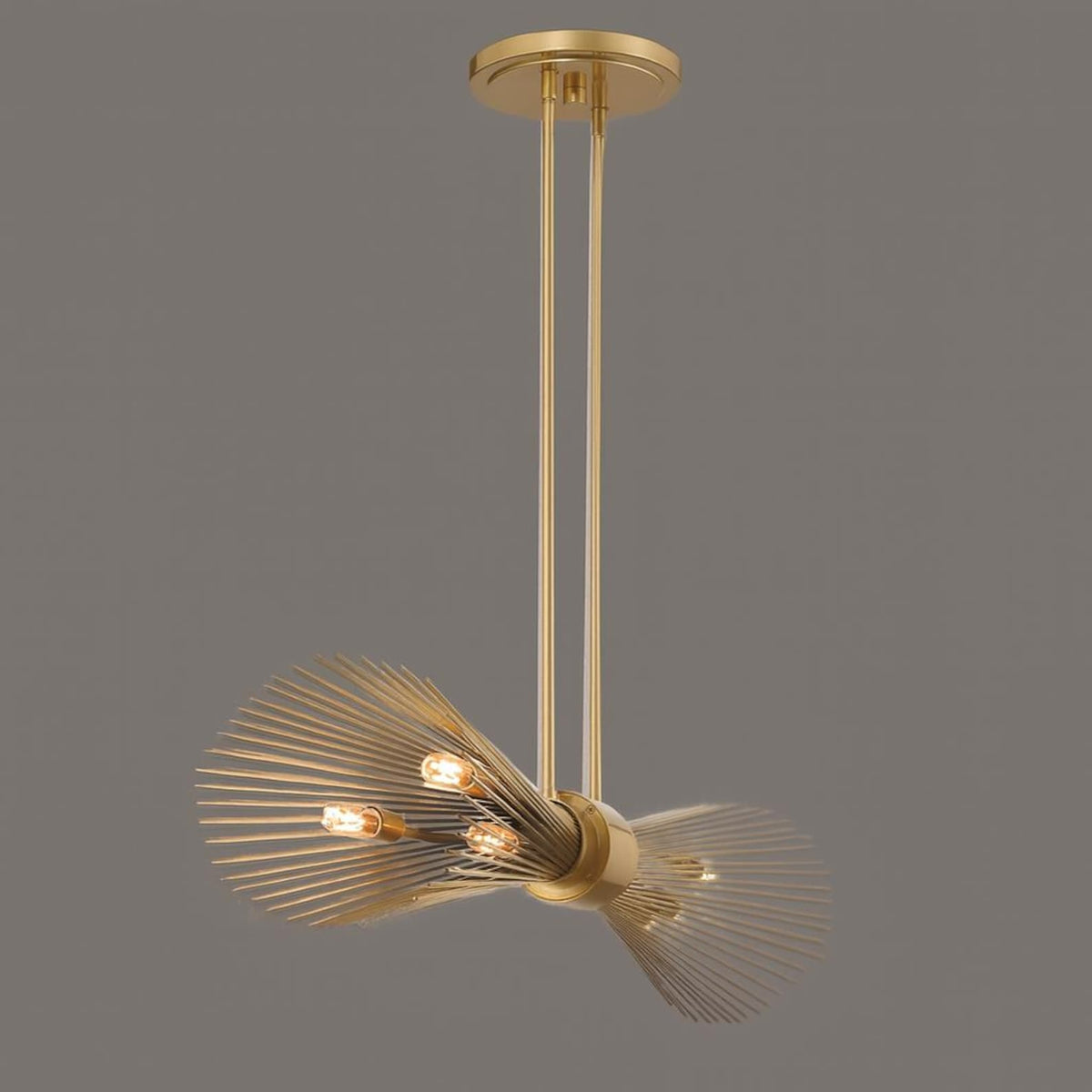 Modern industrial brass chandelier with sculptural wire design and warm lighting, contemporary ceiling fixture
