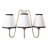 Industrial-style brass wall sconce with three white fabric shades – minimalist handmade design