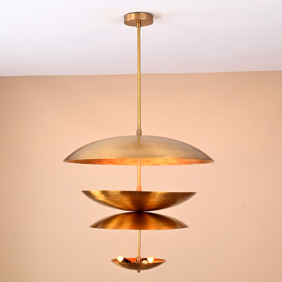 Front view of modern layered brass 6-light disc chandelier with sculptural floating bowl shades.