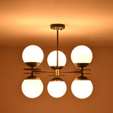 Modern opal glass globe chandelier designed for even ambient light distribution