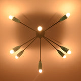 Modern orbit ceiling chandelier creating dramatic indirect lighting and soft shadows