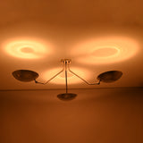 Modern semi flush mount ceiling light with polished chrome finish creating soft ambient ceiling illumination.