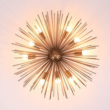 Top-down view of modern brass sputnik chandelier with evenly spaced light bulbs