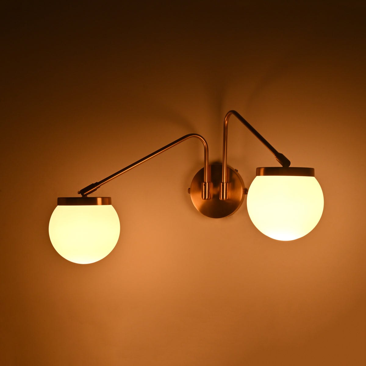 Modern two light globe wall sconce with soft ambient glow for living room, bedroom, and hallway décor