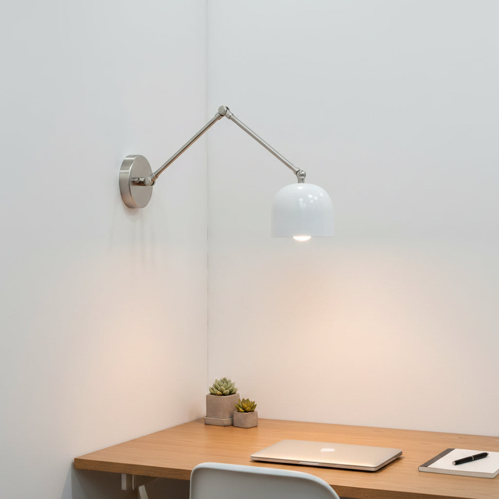 Movable arm brass reading wall light with white oven-baked enamel shade and brushed silver tone hardware