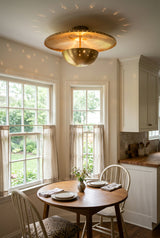 Mykonos 3 light flush mount ceiling fixture in solid brass with warm ambient illumination