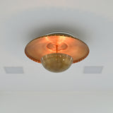Brass patina ceiling fixture with broad shallow disc, central stem and perforated rounded bowl