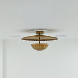 Illuminated Mykonos perforated brass flush mount casting warm decorative light and patterned ceiling shadows