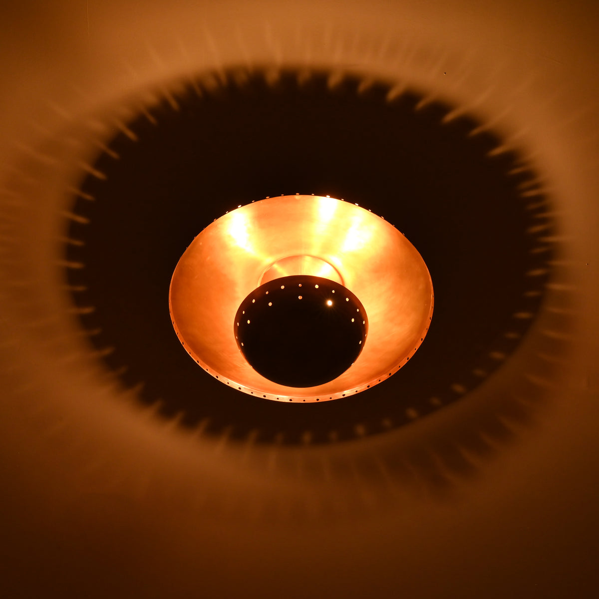 Solid brass flush mount ceiling lamp with 3 lights, sculptural bowl and perforated architectural detailing