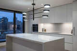 Natural black brass LED pendant light with three slim arms and six round illuminated disc heads