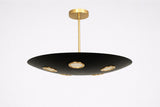 Orbit disc brass chandelier in matte black with gold accents, featuring five recessed lights for warm ambient ceiling illumination.