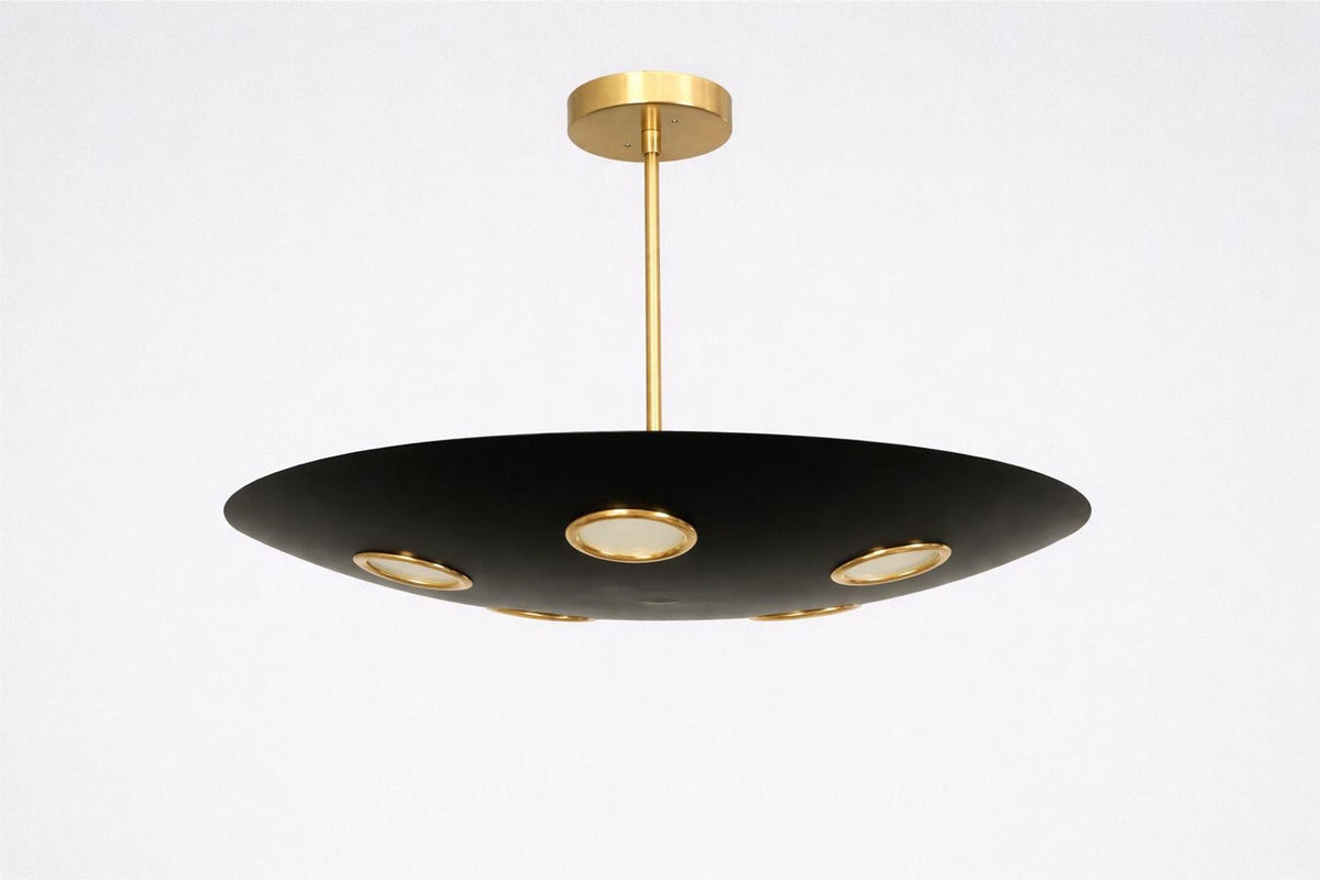 Side view of orbit disc brass chandelier showing slim rod suspension and bowl-shaped black brass shade with integrated lighting.