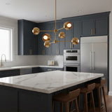 Orion Orbit Globe Chandelier with six rounded brass shades and asymmetric arms – angled view