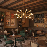 Orion Starburst Cone 24 Light brass chandelier illuminated with globe bulbs
