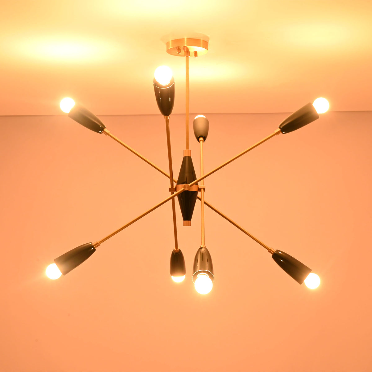Close-up of the Oslo Mid-Century Modern Sputnik Chandelier showing black cone shades and brushed brass details