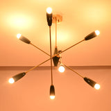 Perspective view of the Oslo Mid-Century Modern Sputnik Chandelier with geometric starburst arms and glowing bulbs
