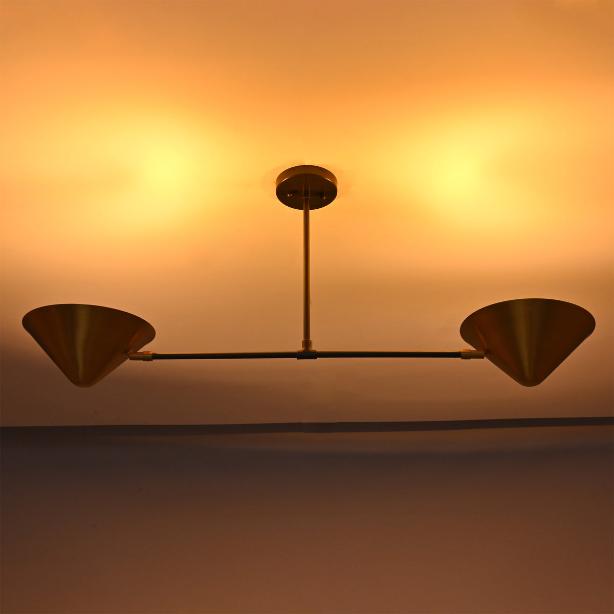 Oslo Modern Double Cone Linear Chandelier highlighting indirect ceiling and ambient lighting effect