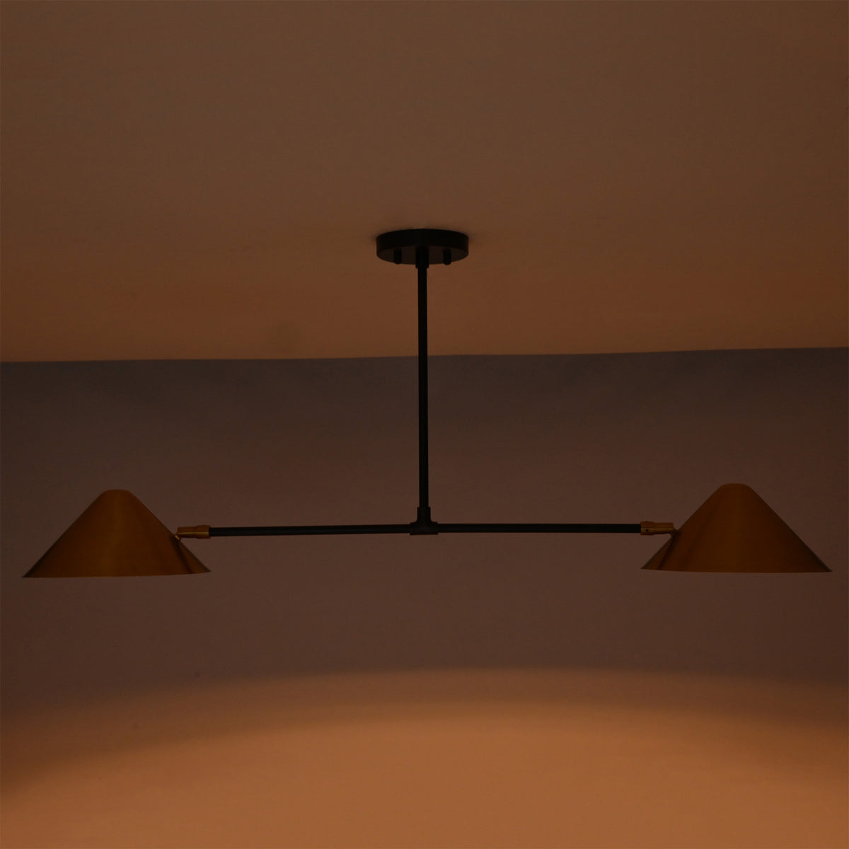 Oslo Modern Double Cone Linear Chandelier providing soft downward ambient lighting