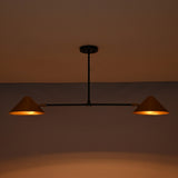 Oslo Modern Double Cone Linear Chandelier with warm illuminated cone shades in low-light setting