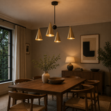 Oslo 4 Light Multi-Cone Chandelier installed above a wooden dining table in a warm modern dining room, Model 62009
