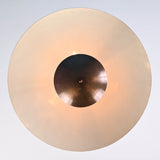 Overhead view of sculptural brass pendant light with wide dome shade and central brass accent, handmade by Brass Leaf Studio.