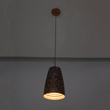 Patina cylinder pendant light closeup highlighting the ribbed shade texture and decorative blue copper finish