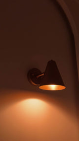 Bruges compact wall light video featuring the 5 inch wide cone shade, 7 inch height and adjustable solid brass construction