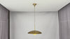Solid brass pendant light video highlighting raw brass aesthetic, natural surface character, spare glass globe, and ceiling installation details
