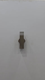 Marbella rectangular solid brass tube wall sconce video showing brass patina finish, vertical slotted design, and warm up-down wall illumination